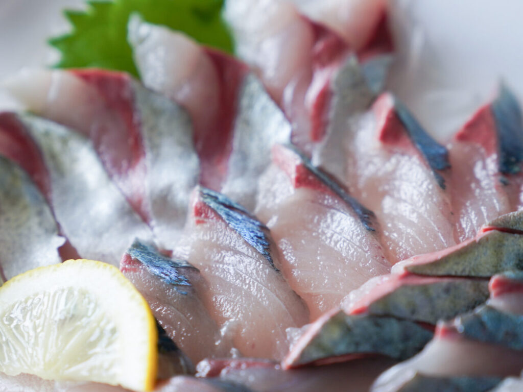 Silver-skinned blue-backed fish served as sashimi with the skin left on
