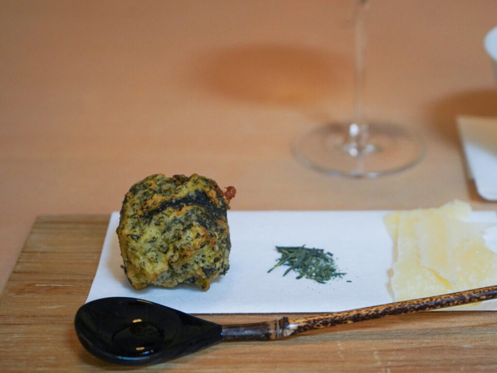 Tempura served with a small mound of green matcha salt
